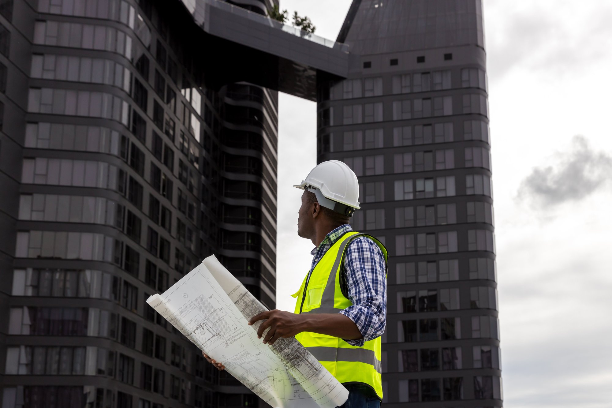 engineers-with-draft-plan-of-building-on-construct-2023-11-27-05-09-21-utc (1)
